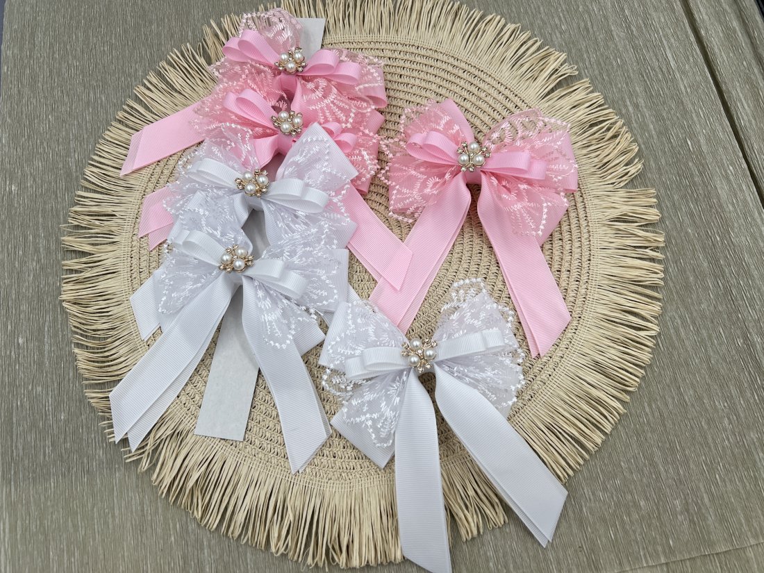 Бантики на затиску. білі рожеві з мережевом