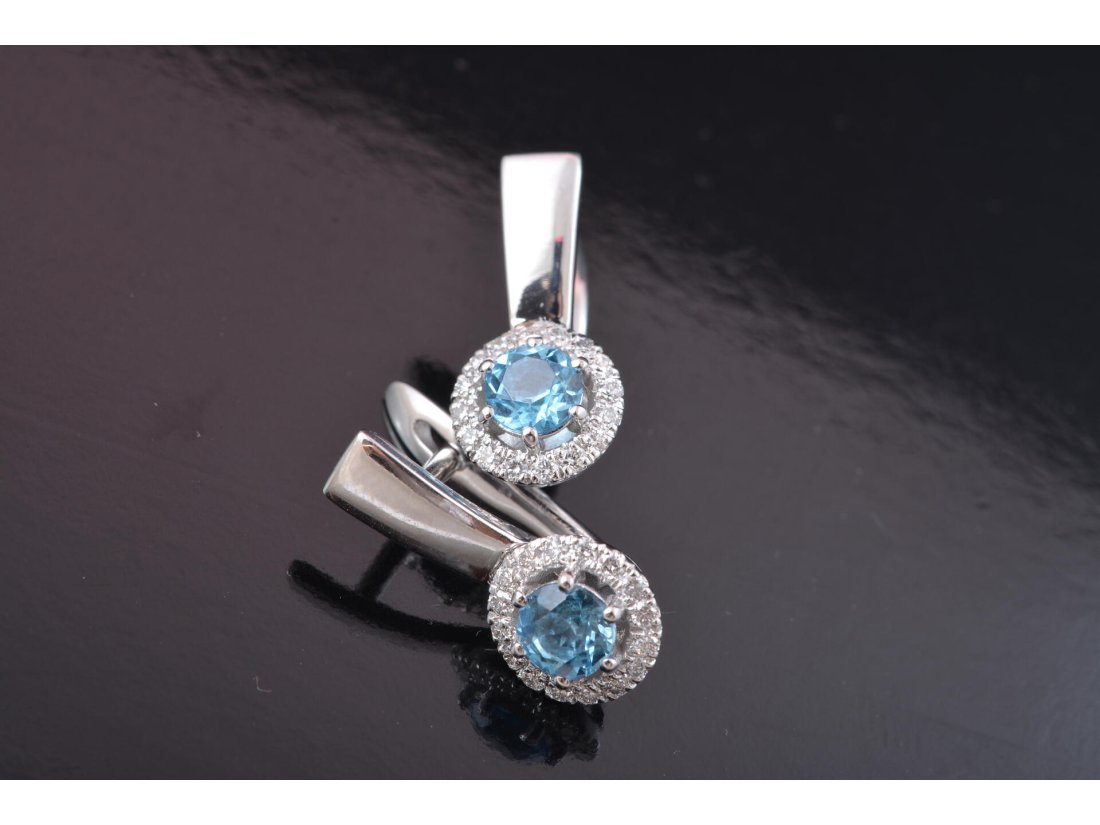 Сережки із топазом та діамантами